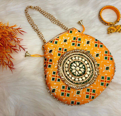 Yellow Patola Potli with Pearl Handle