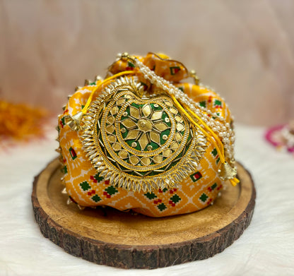 Yellow Patola Potli with Pearl Handle